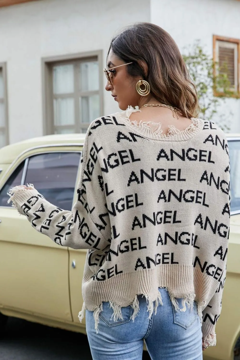 ANGEL Distressed Printed V-Neck Dropped Shoulder Sweater