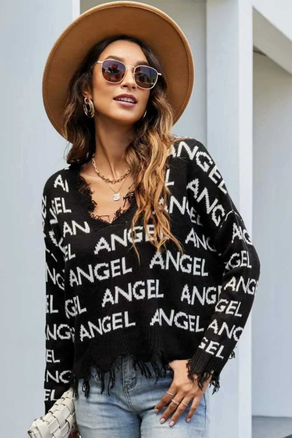 ANGEL Distressed Printed V-Neck Dropped Shoulder Sweater