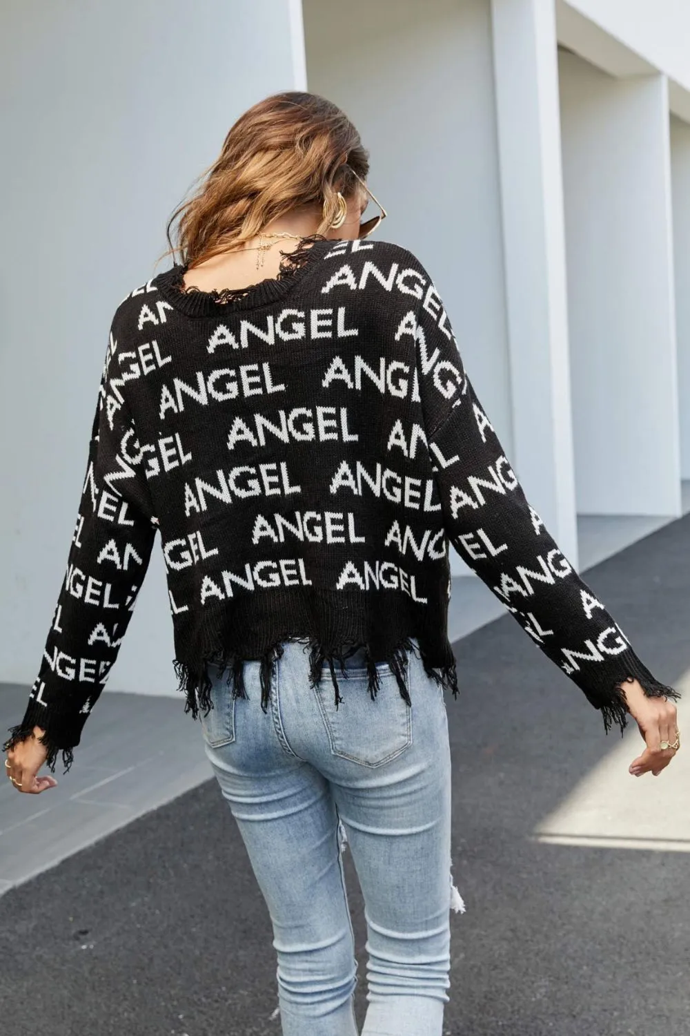 ANGEL Distressed Printed V-Neck Dropped Shoulder Sweater