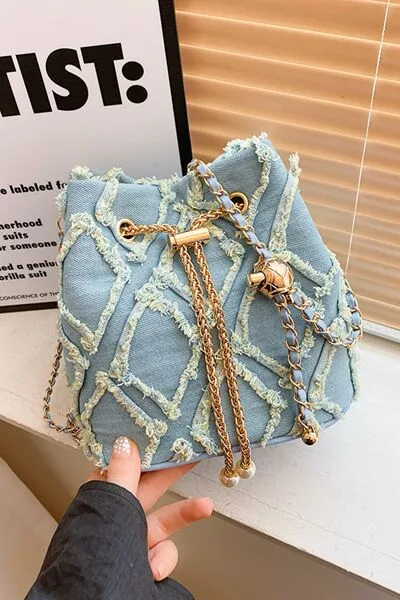 Denim emmertas met kettingkoord en ruwe rand