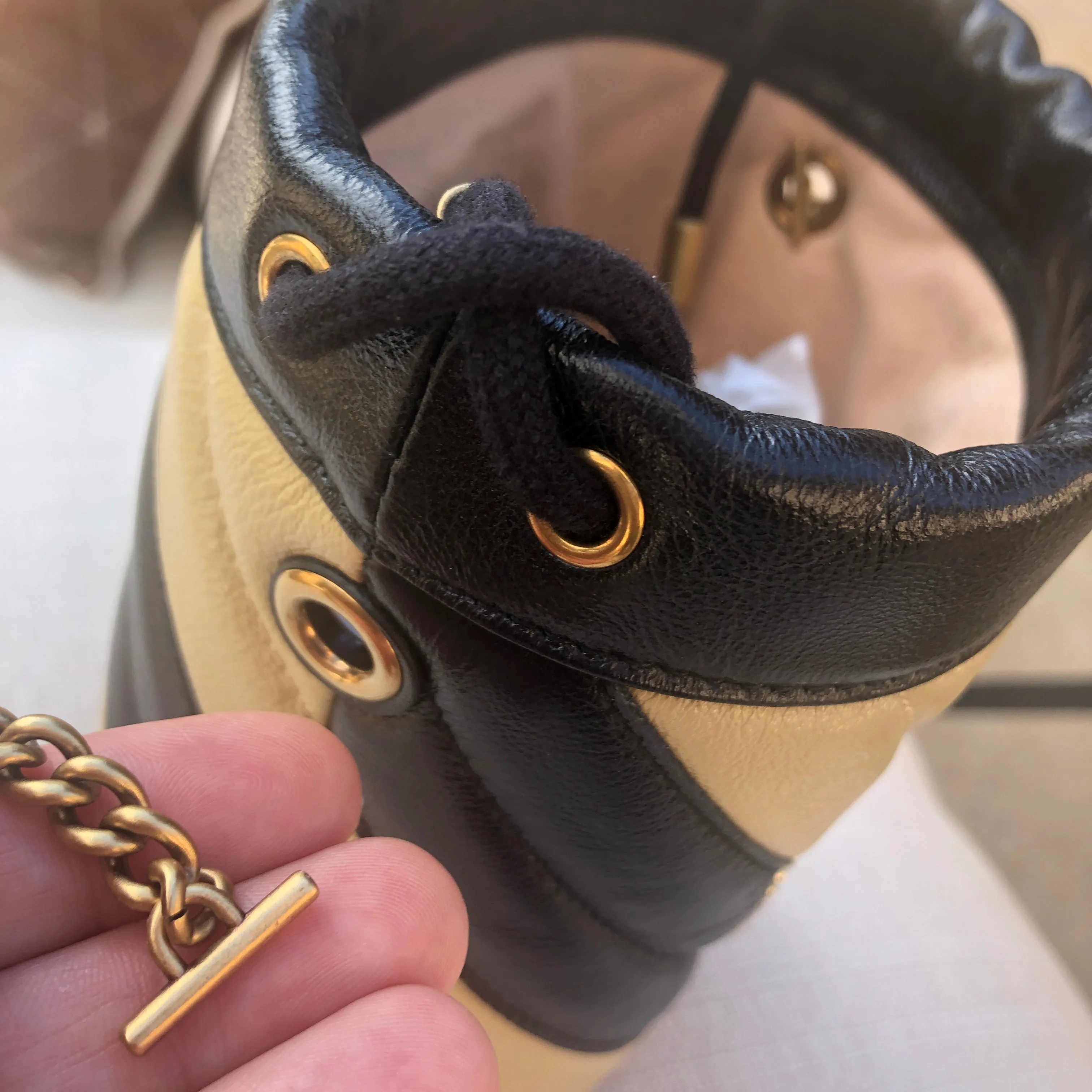 Gucci GG Marmont Bucket Bag in Black and Beige with Red Trim