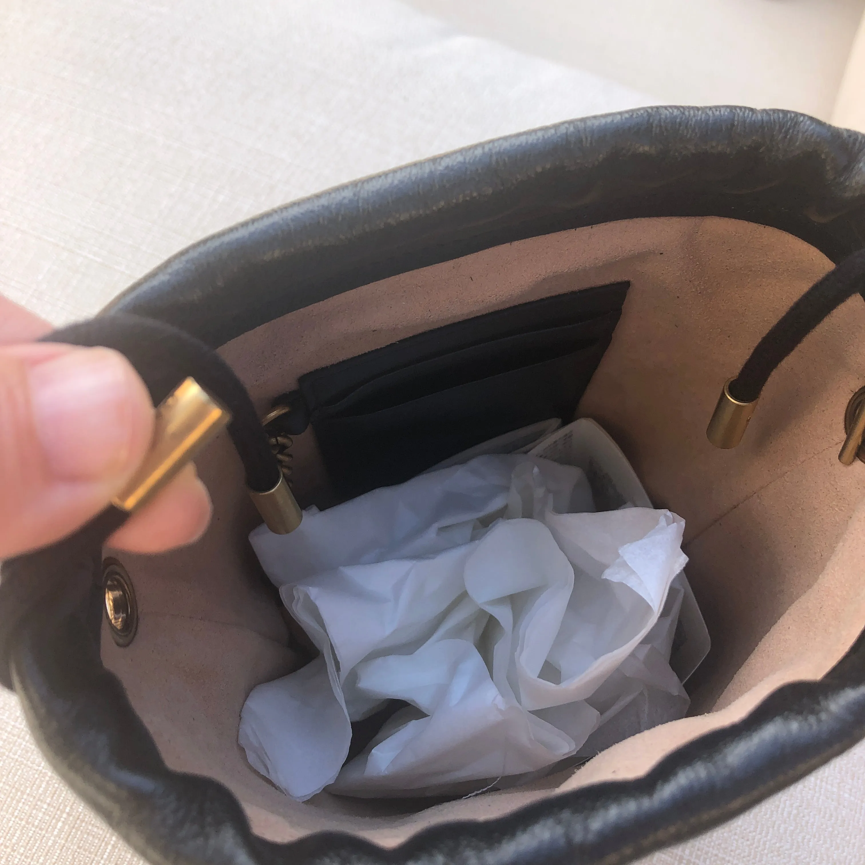 Gucci GG Marmont Bucket Bag in Black and Beige with Red Trim