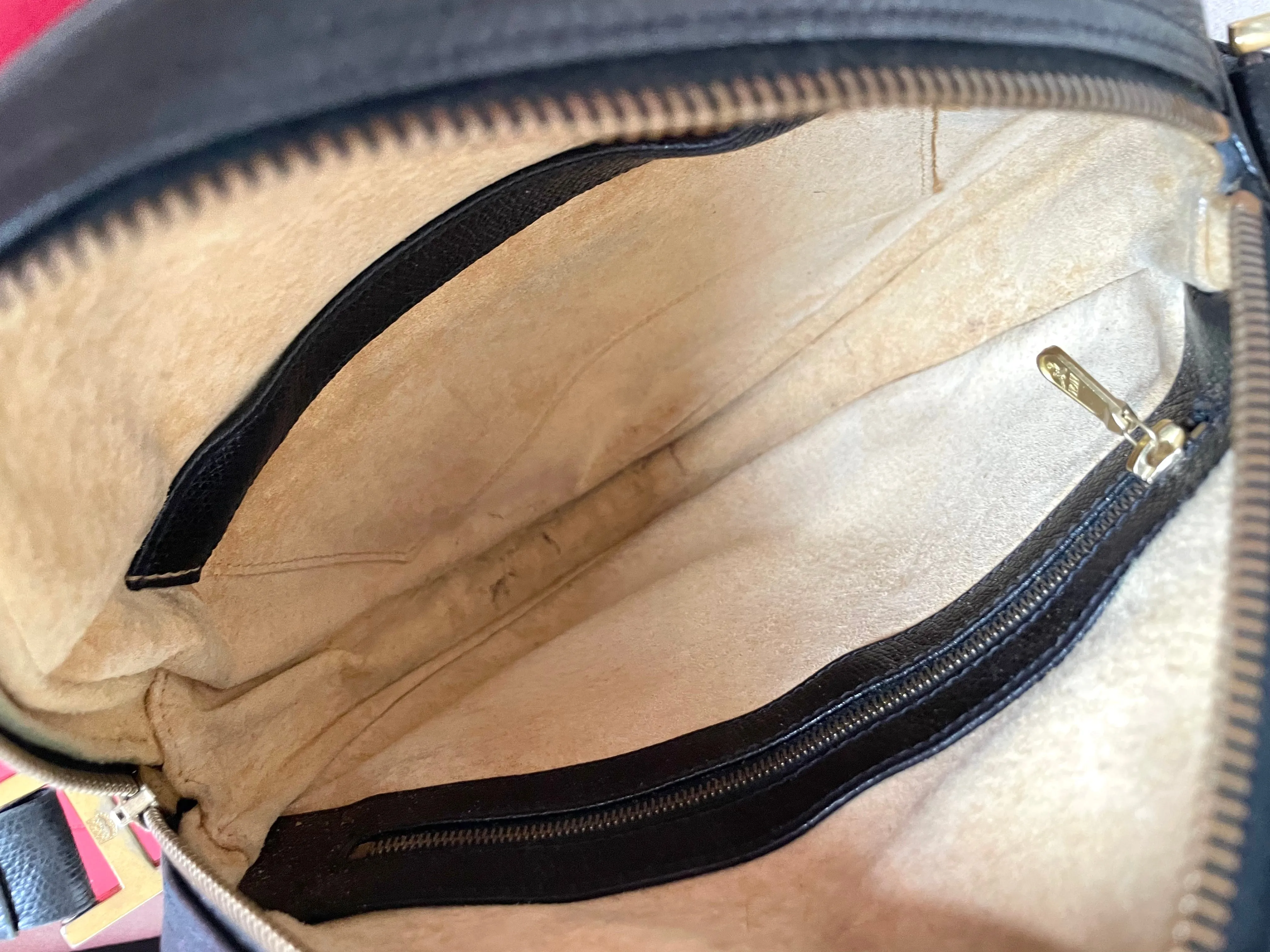Vintage MCM black suzy wong, grained leather round shoulder bag with golden logo studs and fringes. Designed by Michael Cromer.0407051