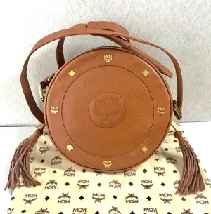 Vintage MCM suzy wong bag, brown grained leather round shoulder bag with studs and fringes. Designed by Michael Cromer. Nature. 060531r8