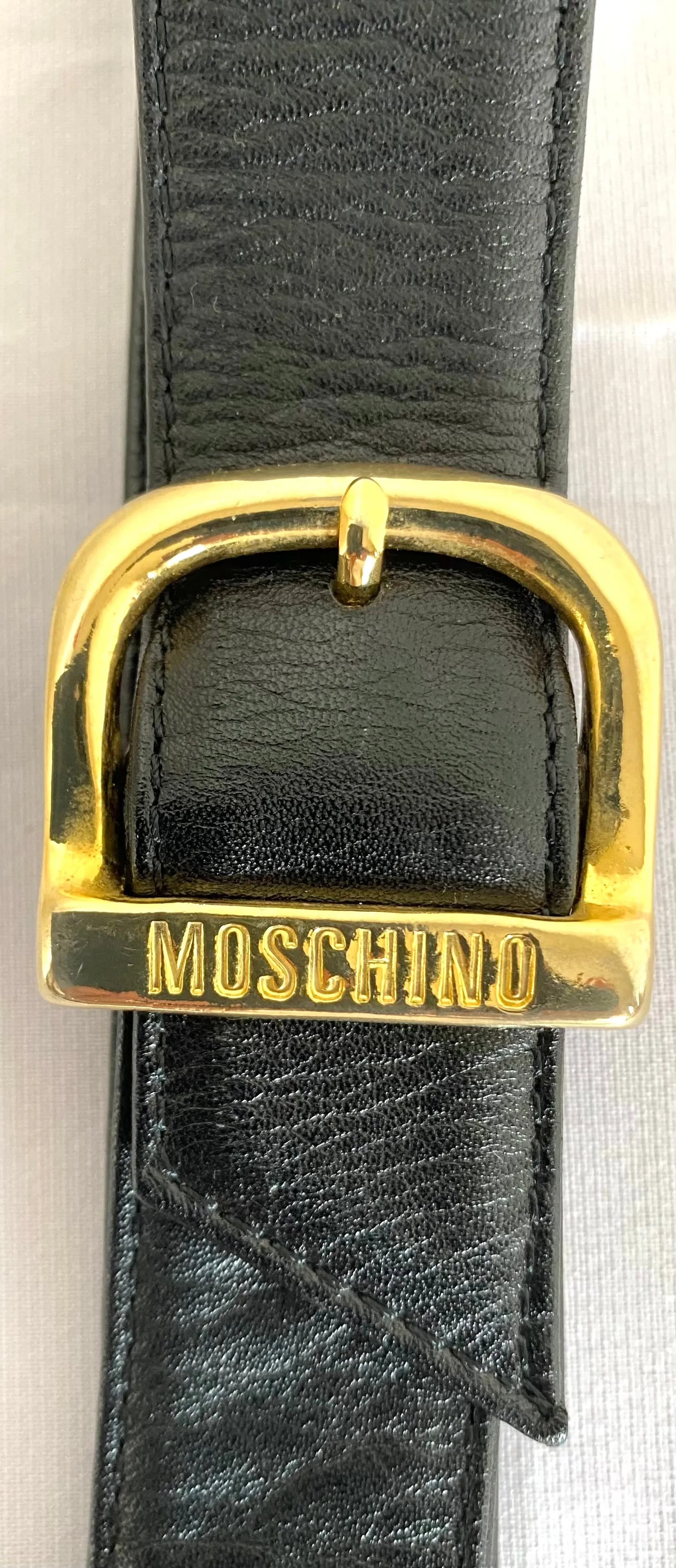 Vintage Moschino black leather shoulder bag with golden cute dangling charms. Heart, safety pin, trumpet, sacks, and guitar. 050725