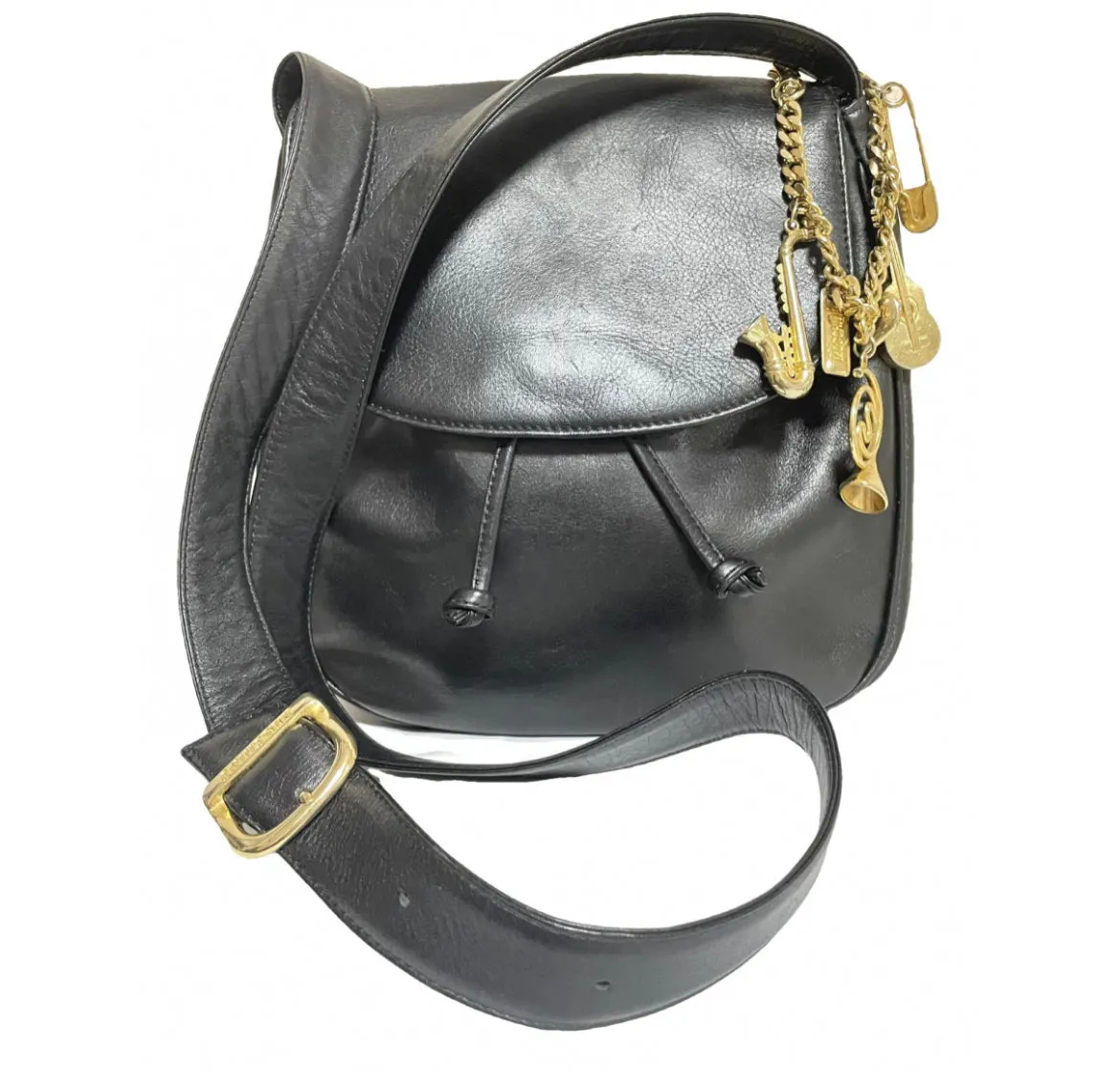 Vintage Moschino black leather shoulder bag with golden cute dangling charms. Heart, safety pin, trumpet, sacks, and guitar. 050725